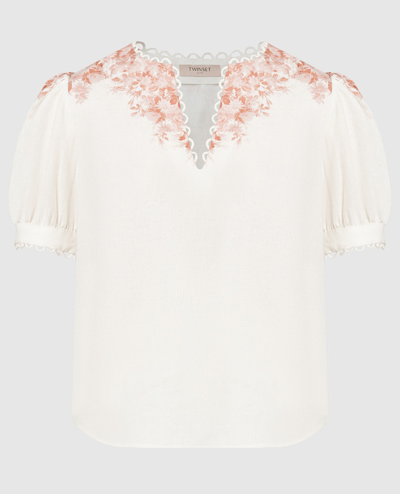 Белая блуза из льна с цветочным принтом.