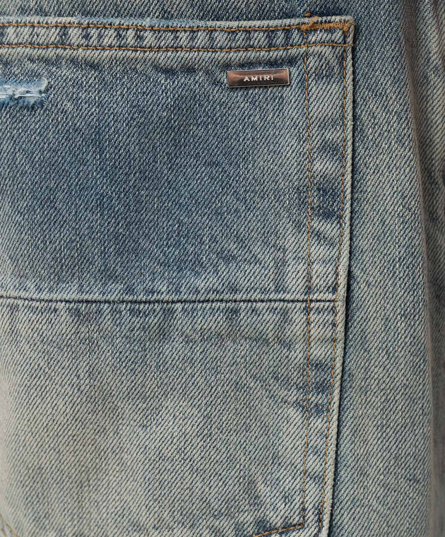 AMIRI - Голубые джинсы с эффектом потертости с логотипом