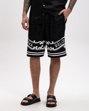 Dolce&Gabbana Черные шорты из шелка с логотипом GV37ATGI979