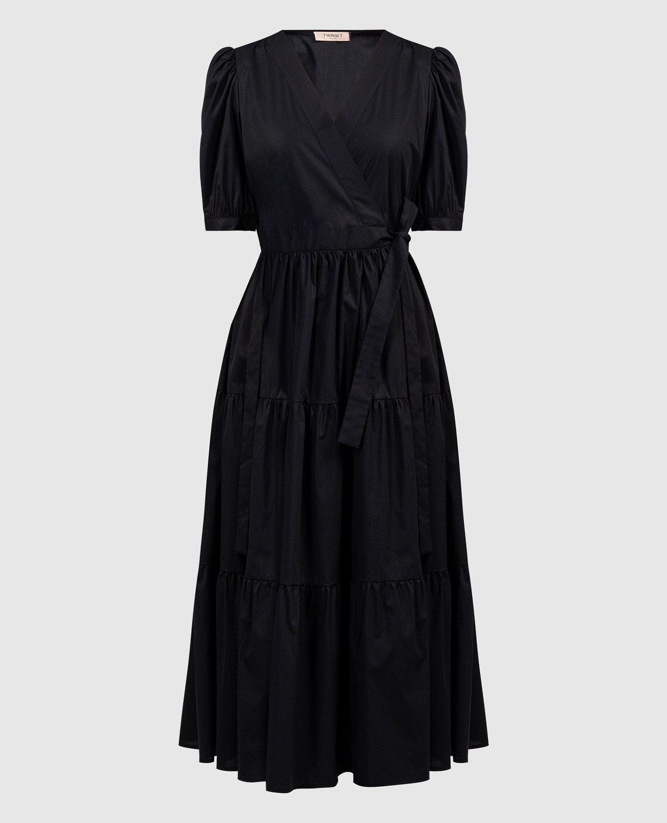 Black dress with drape and metal logo