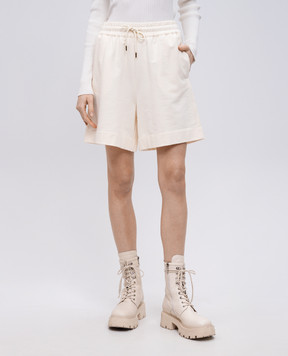 Moncler Бежевые шорты с нашивкой логотипа K10938H0001189A1K
