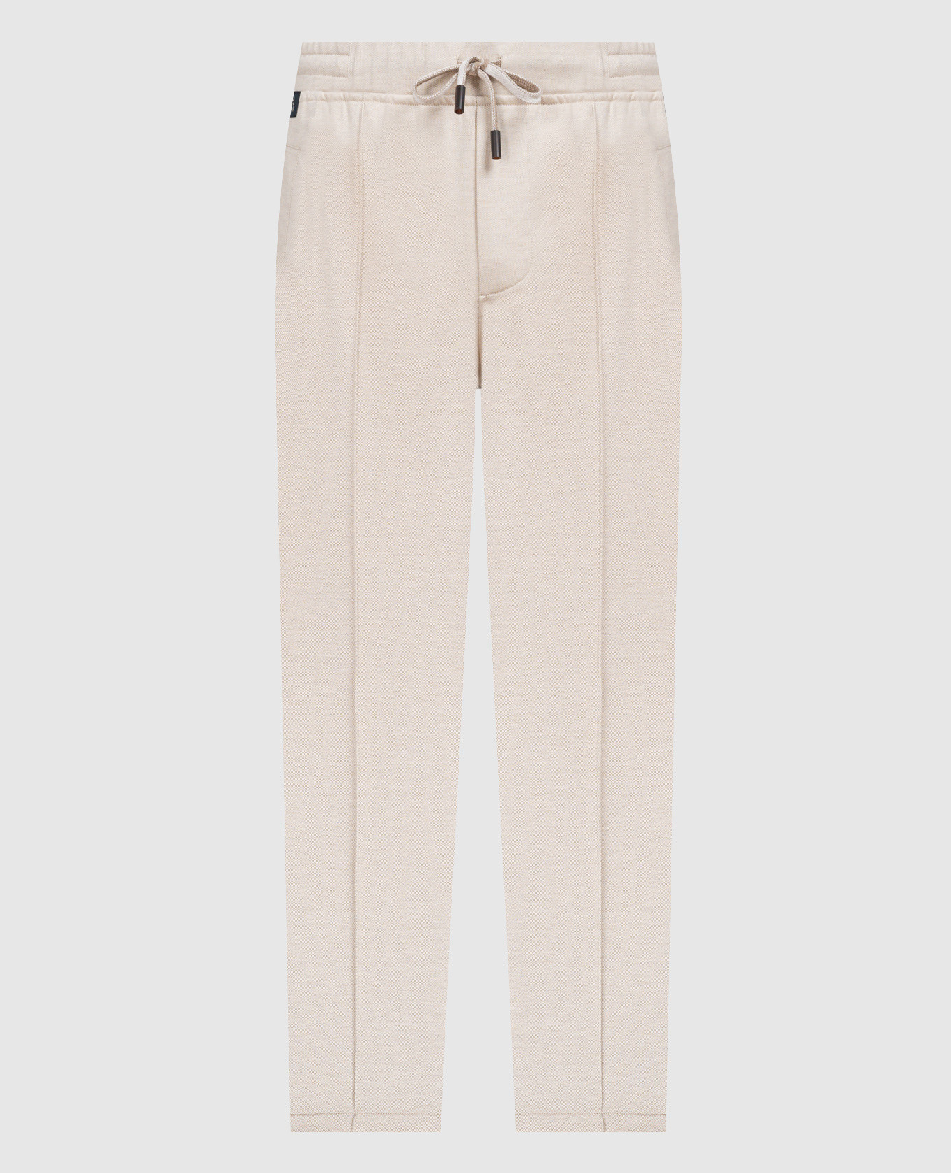 Beige sweatpants with a logo patch