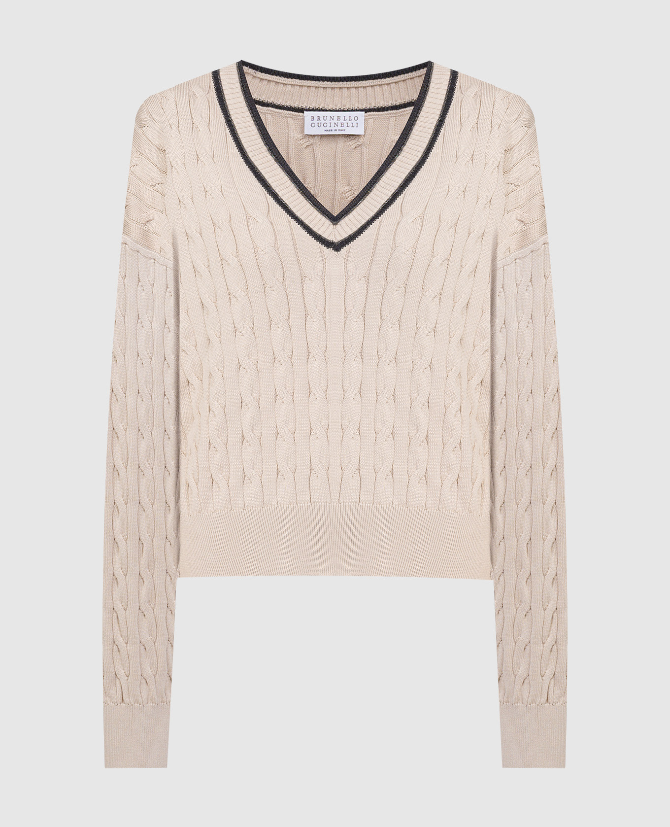 Beige pullover in a textured pattern with a monil chain