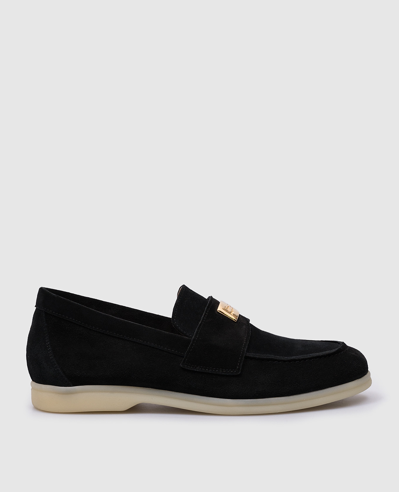 Black suede loafers with metallic logo