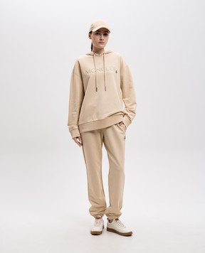 Moncler Бежевые джогеры с нашивкой логотипа J20938H0001089A1K