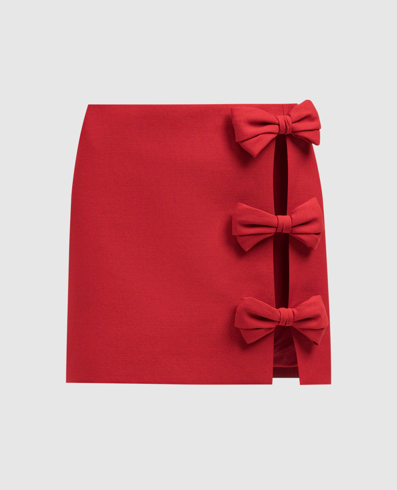 Красная юбка мини из шерсти и шелка с бантами.